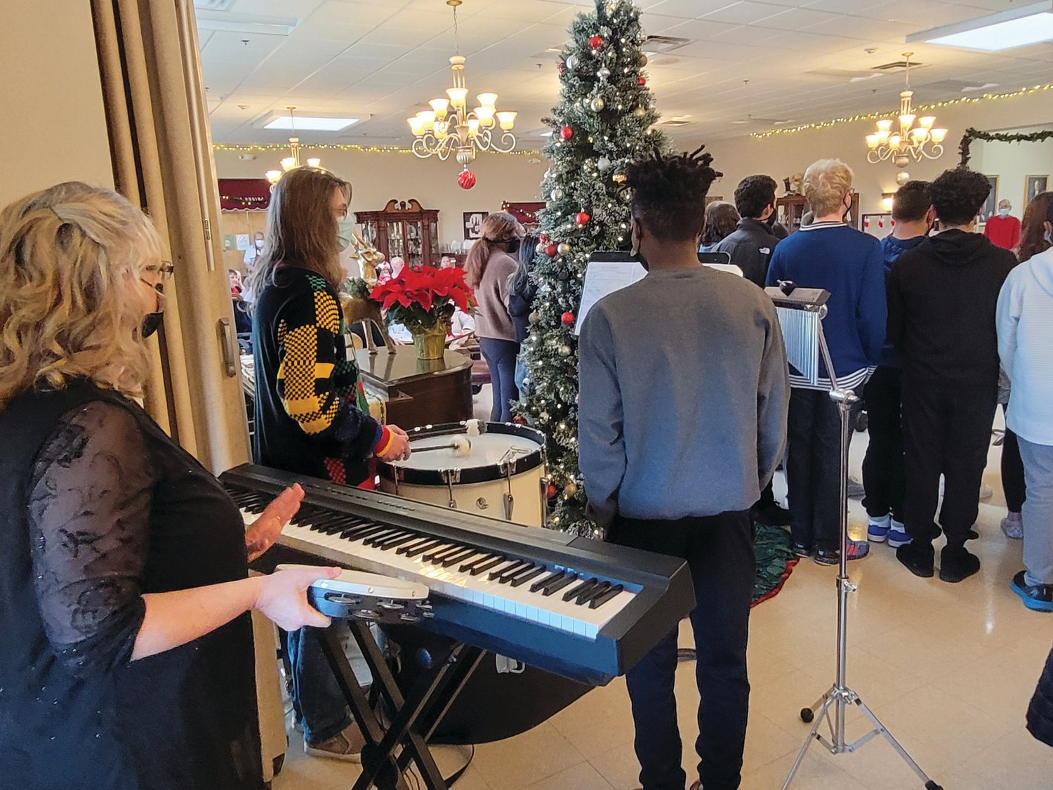 CHRISTMAS PARTY: Members of the Johnston Senior Center had drinks and snacks prior to a rousing performance by the Johnston High School Chorus.